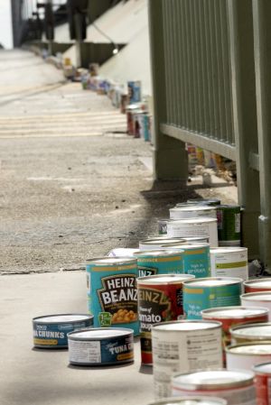 The tins are lined across the bridge.