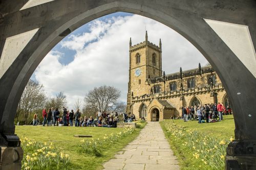 crowd spills out onto the church grass